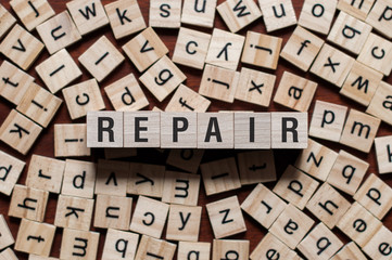 repair word background on wood blocks