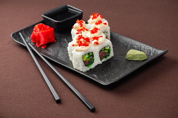 sushi on a black plate