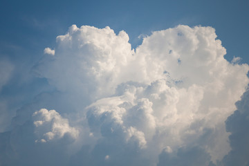 Naklejka na ściany i meble Cloud in the shape of a heart. Blue sky with white clouds. 