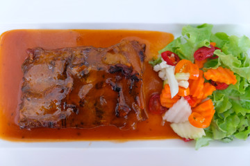 Roasted pork spare ribs marinated in barbecue sauce