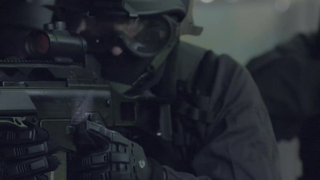 Slow Motion &ndash; Detail &ndash; A Special Force Team walk in a open corridor.