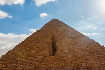 Fototapeta na wymiar Great Pyramid of Giza (also known as the Pyramid of Khufu or the Pyramid of Cheops) is the oldest and largest of the three pyramids in the Giza pyramid complex