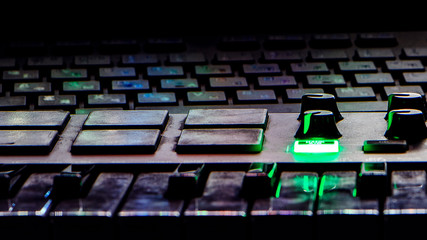 Abstract computer keyboard image, purple neon color, green neon key color, creative design dark blurred background
