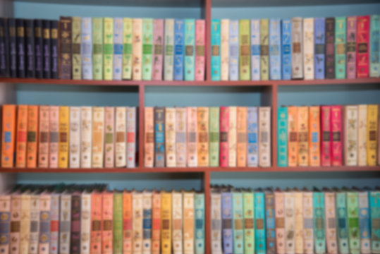 Blurred image of bookshelves in a public library. School library. Education concept