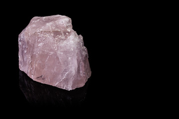 Large Piece of Rose Quartz on a Reflective Black Background