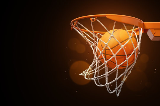 3d rendering of a basketball in the net on a dark background.