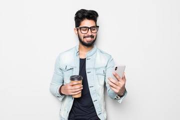 Portrait of young happy Indian man making video call from the phone isolated on white background