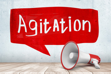 3d rendering of white red megaphone with red white AGITATION sign on white wall background