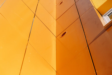 Parts of the facades of modern houses. Bright juicy colors in the construction of buildings.