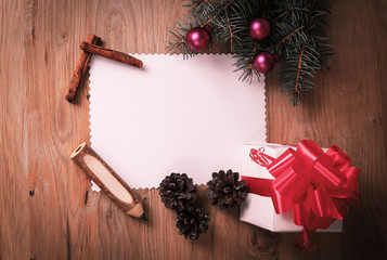blank Christmas card and a box with gift on Christmas background