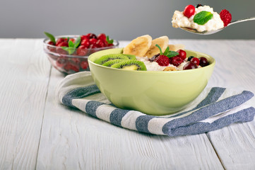 porridge with fruit on wooden background