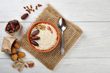 porridge with fruit on wooden background