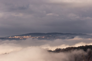 Obraz na płótnie Canvas A view of Perugia city (Umbria, Italy) above a sea of fog
