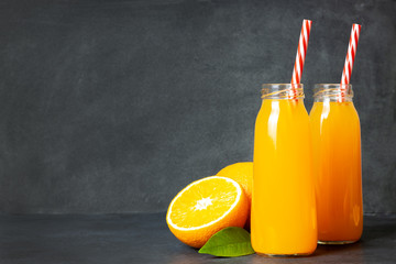 Fresh orange juice in the glass bottle