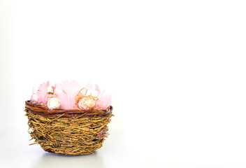 Fototapeta na wymiar Easter composition with traditional decor. Small decorative colorful eggs and soft feathers on white background.