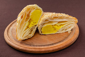sliced croissant on a wooden board