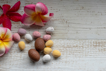 Chocolate Easter Eggs on a Wooden Background.