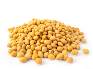 Raw dried soybeans on white background.