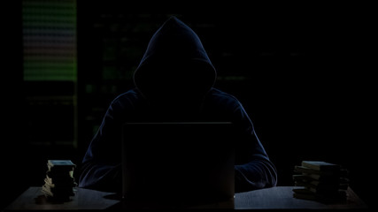 Cybercriminal transferring money to offshore bank account, illegal profit