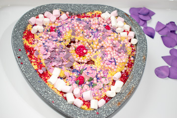 Heart shaped decorated home made cake