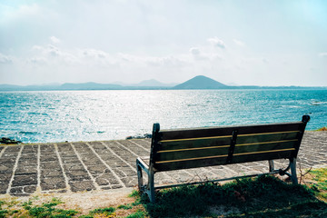 Abandoned, Back, Backgrounds, Beach, Bench, Blue, City Break, Clear Sky, Day, Empty, Footpath, Grass, Green Color, Horizon, Horizon Over Water, Horizontal, Idyllic, Landscape - Scenery, Nature, No Peo