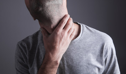Fototapeta premium Caucasian man suffering from neck pain.