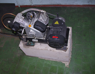 Compressor on oiled floor.