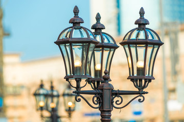 Closeup of vintage metal lantern in the city