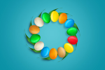 Multi-colored Easter eggs in the form of a circle. Copy space. Blue background. Easter.