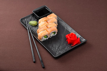 sushi on a black plate