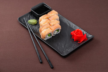 sushi on a black plate