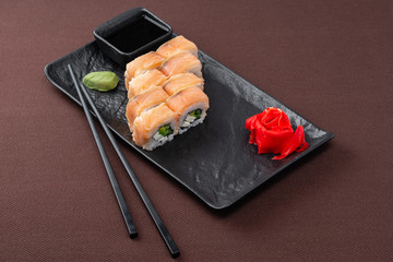 sushi on a black plate