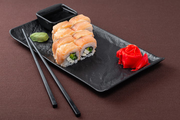 sushi on a black plate