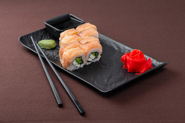 sushi on a black plate