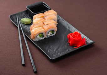 sushi on a black plate