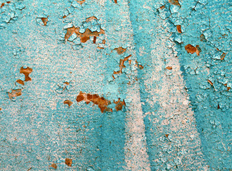 Old wooden background with remains of pieces of scraps of old paint on wood. Texture of an old tree, board with paint, vintage background peeling paint. old blue 