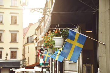 swedish flag in old town stockholm