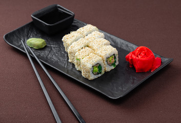 sushi on a black plate