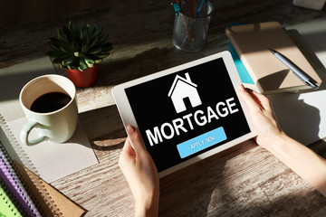 Mortgage online application form on device screen. Business and finance concept.
