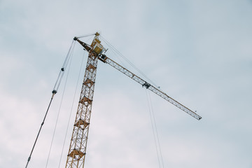 Construction of modern high-rise buildings. Cranes and machinery