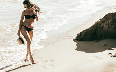 woman in hat on the beach
