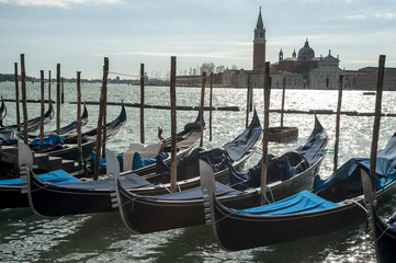 Fototapeta na wymiar Gondolas moored at Piazza San Marco in Venice