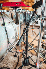 Drummer recording drum sounds, Sound recording studio.