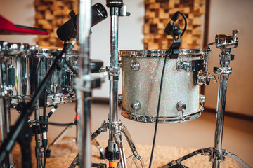 Fototapeta na wymiar Drummer recording drum sounds, Sound recording studio.