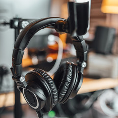 Close up view on professional headphone in sound recording studio.