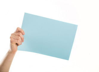 Hands holding blue empty paper blank a4 size for letter paper
