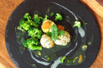 forcemeat balls with sauce and vegetable