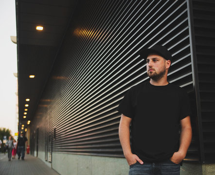 Young Man Near Black Wall In City Street