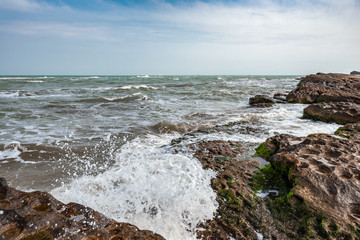 Splash of waves on a rocky seashore