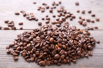Coffee beans on grey wooden background